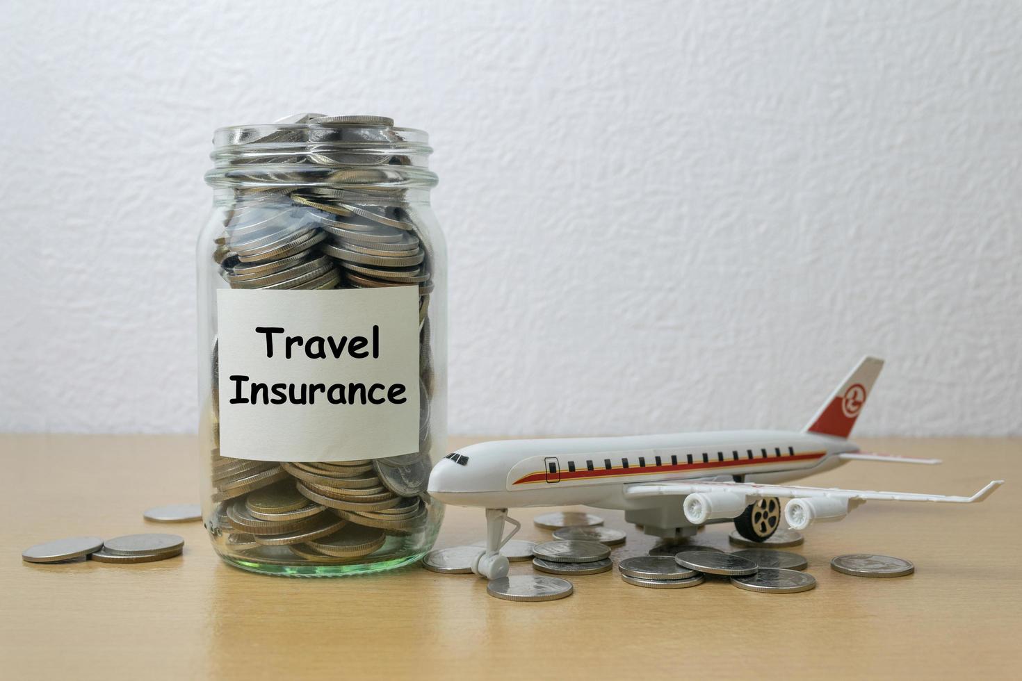 Money saving for travel Insurance in the glass bottle photo