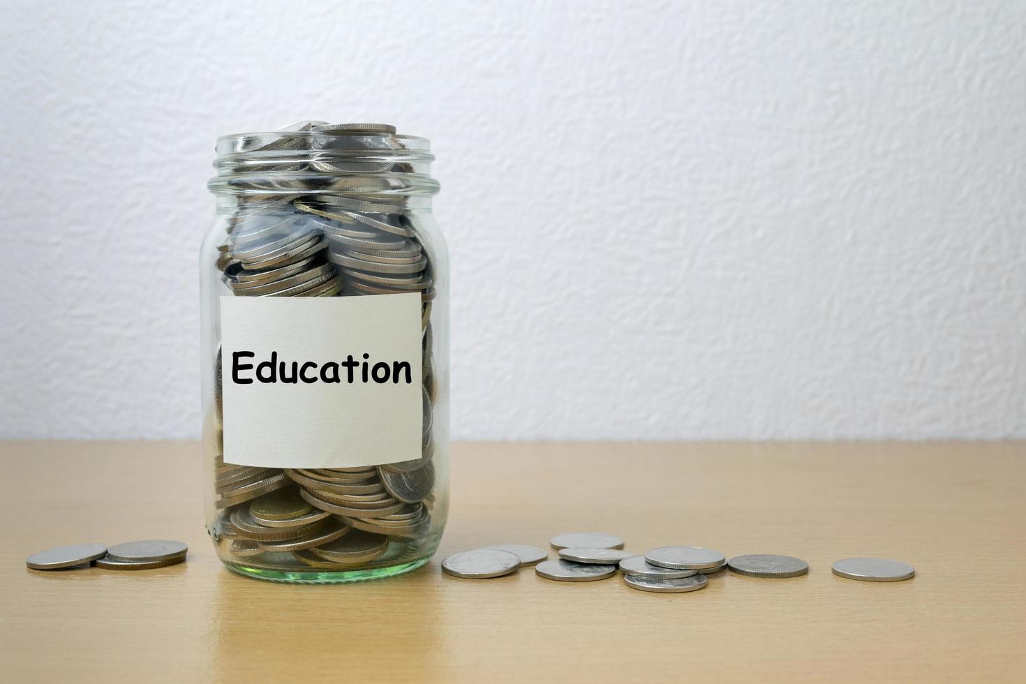 Money saving for Education in the glass bottle photo