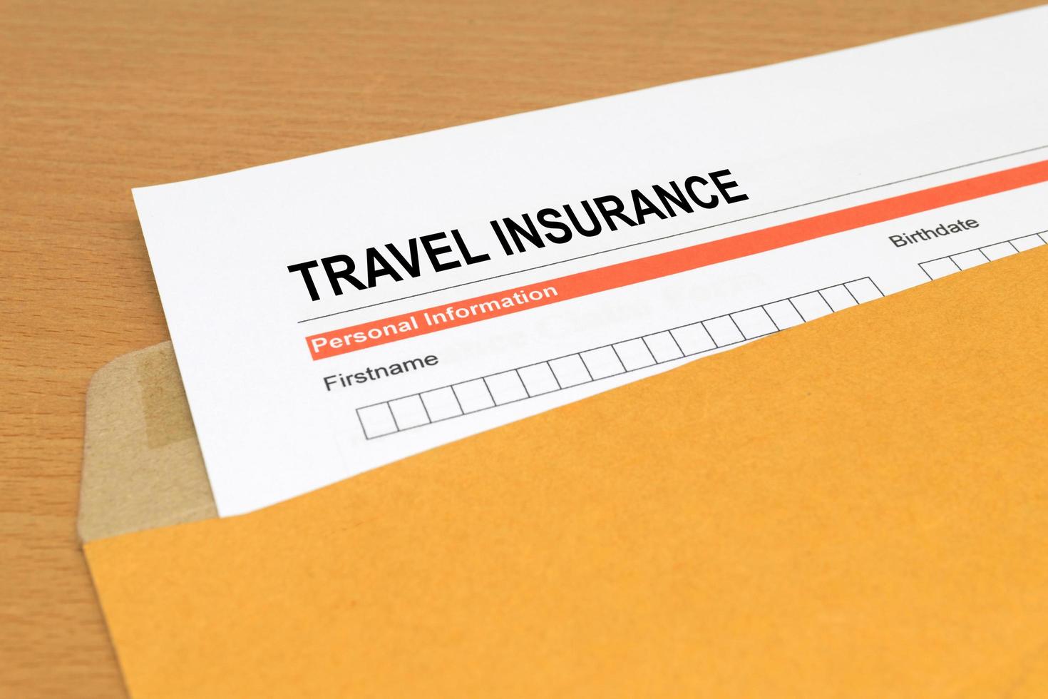 travel Insurance application form on brown envelope photo