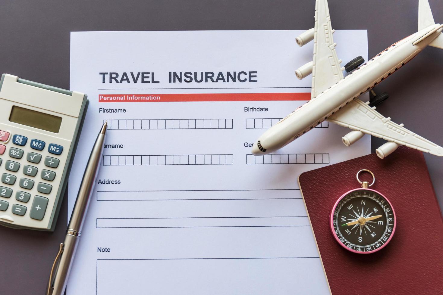 Travel  insurance form with model and policy document photo