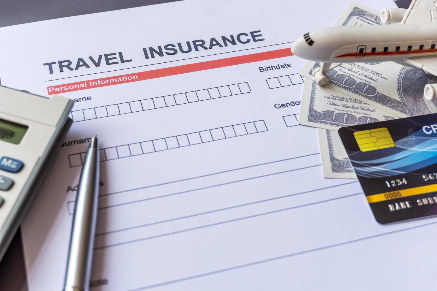 Travel  insurance form with model and policy document photo