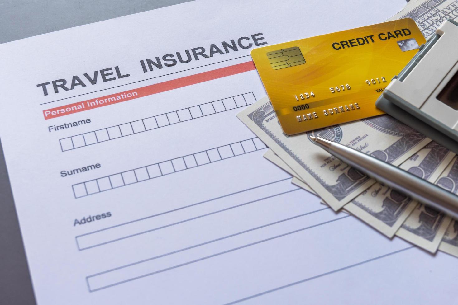 Travel  insurance form with model and policy document photo