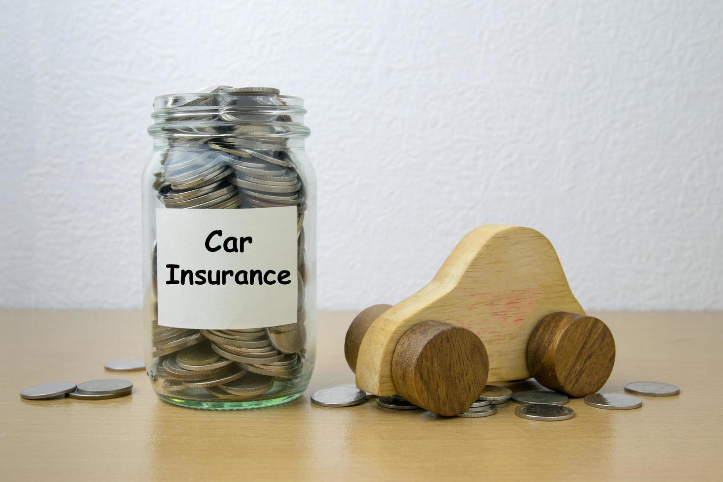 Money saving for Car Insurance in the glass bottle photo