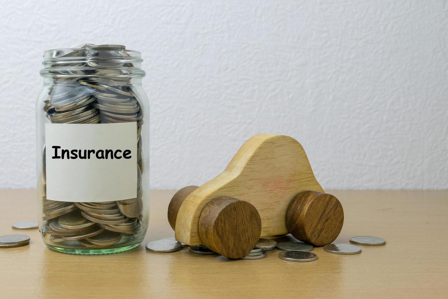 Money saving for Insurance in the glass bottle photo