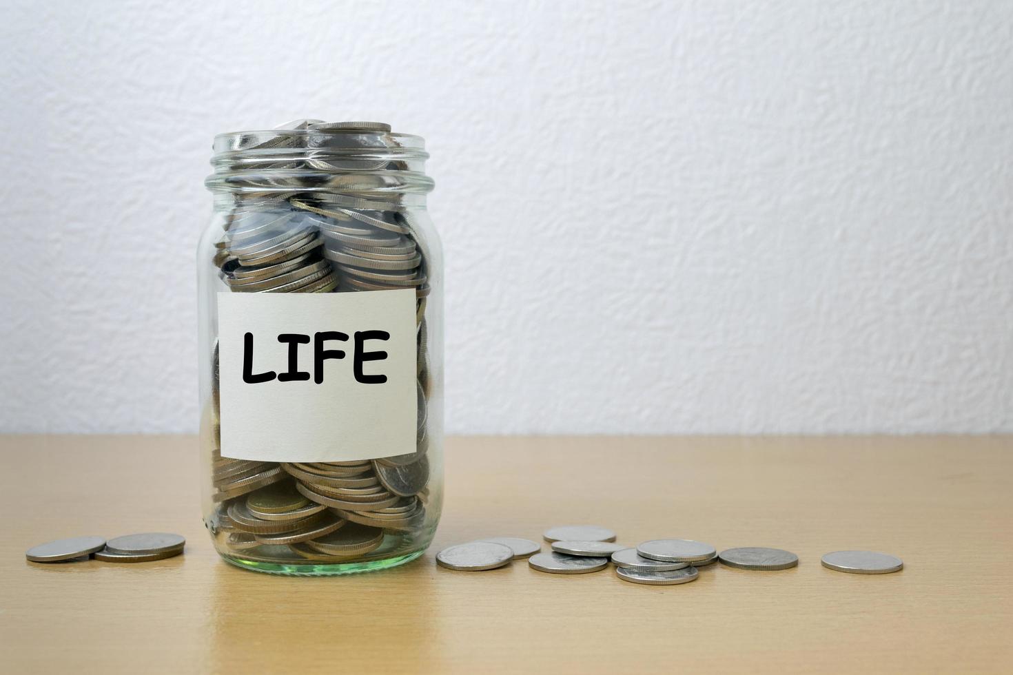 Money saving for life in the glass bottle photo