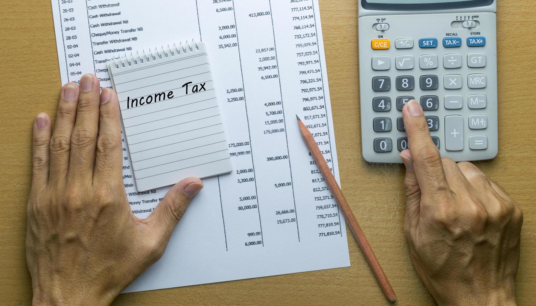Man Planning monthly income tax photo
