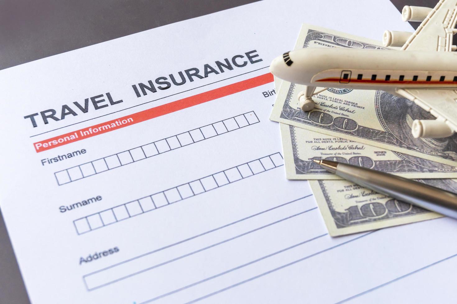 Travel  insurance form with model and policy document photo