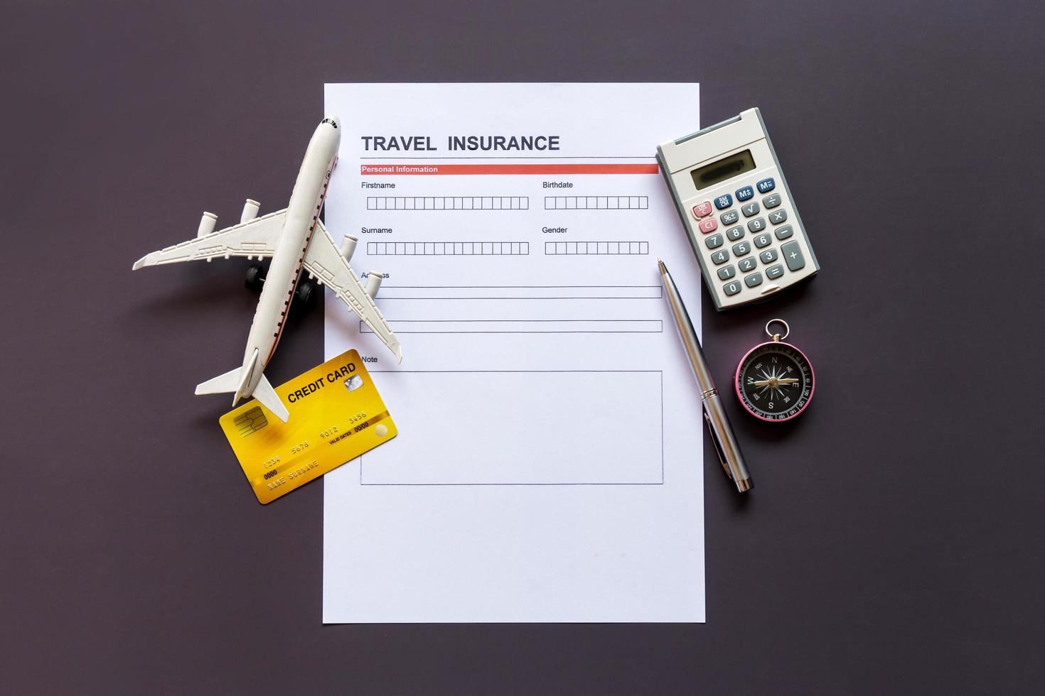 Travel  insurance form with model and policy document photo