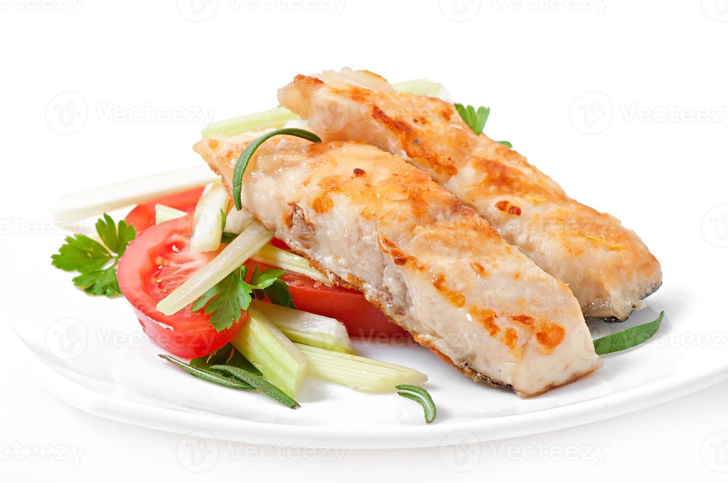 Fried filet fish and fresh vegetable salad photo