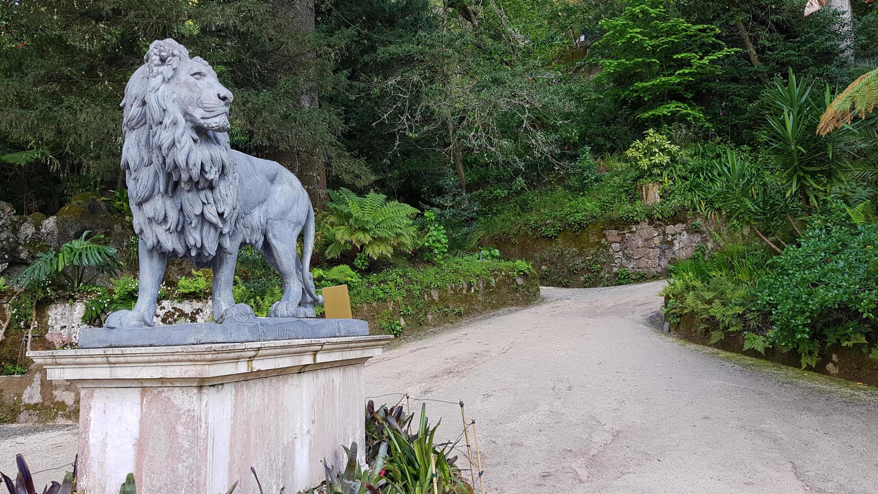 Sintra, Portugal, 04-24-2020,  lion statue in sintra gardens photo