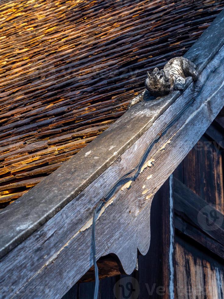 Sculpture of Mom at the roof of temple building in Northern Provinces of Thailand photo