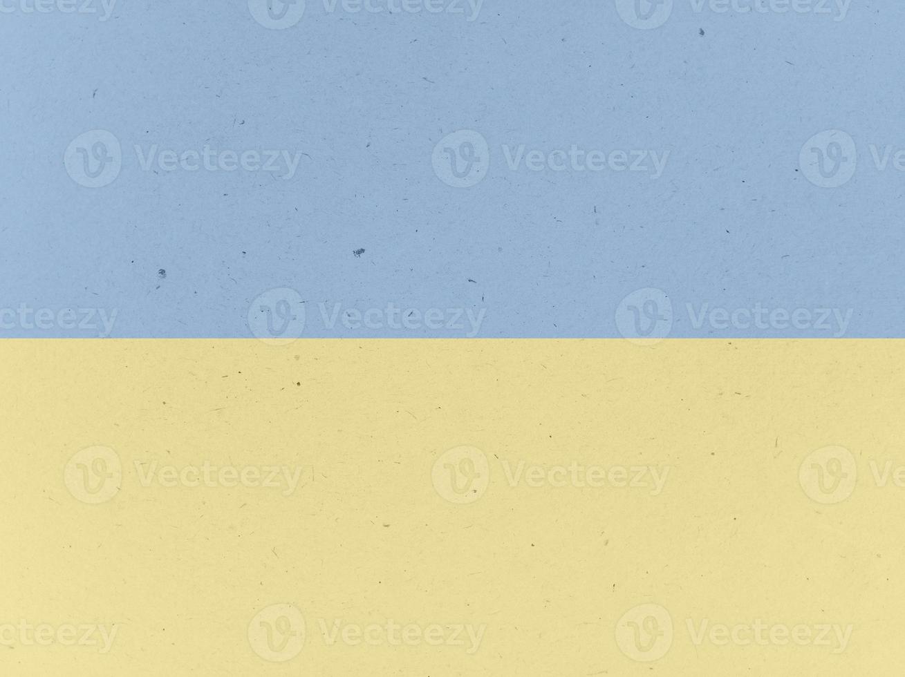 Old paper with spotted texture background. Blue and yellow colors. photo