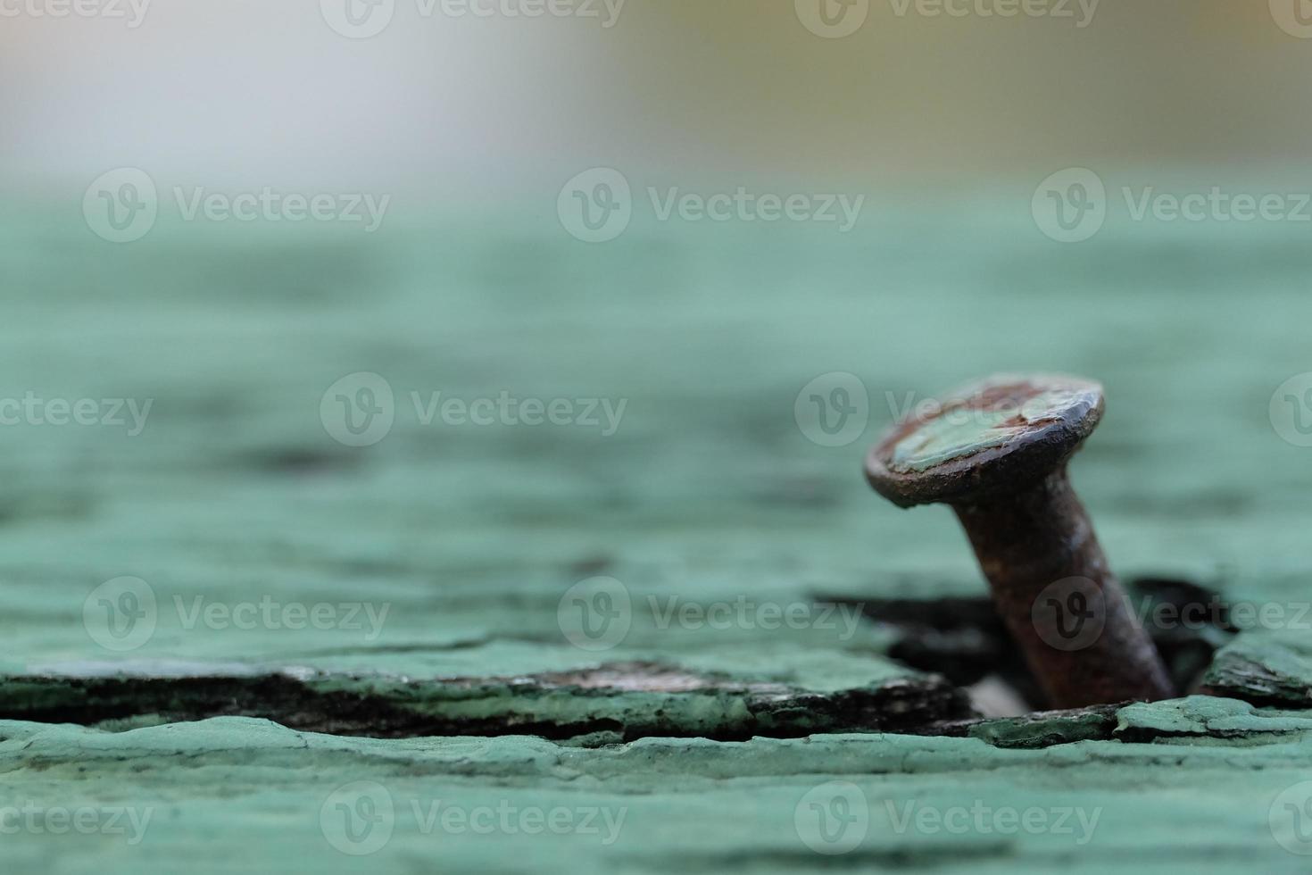 Rusty nail on old wood background with soft focus, Closeup view, Copy space photo