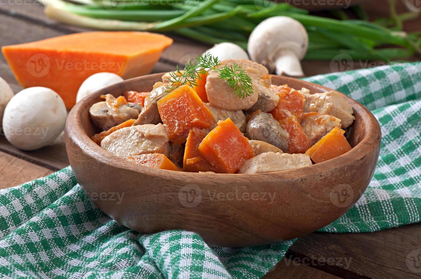 Stew chicken with vegetables and mushrooms in a cream sauce photo