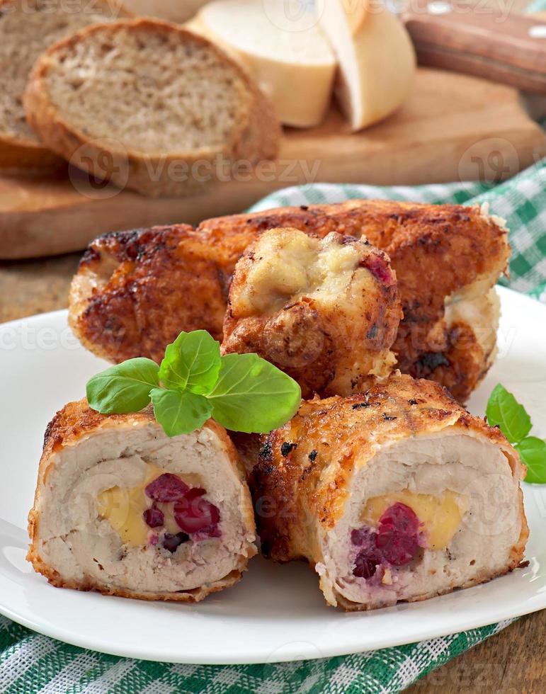 Chicken rolls with cranberries, cheese and honey photo