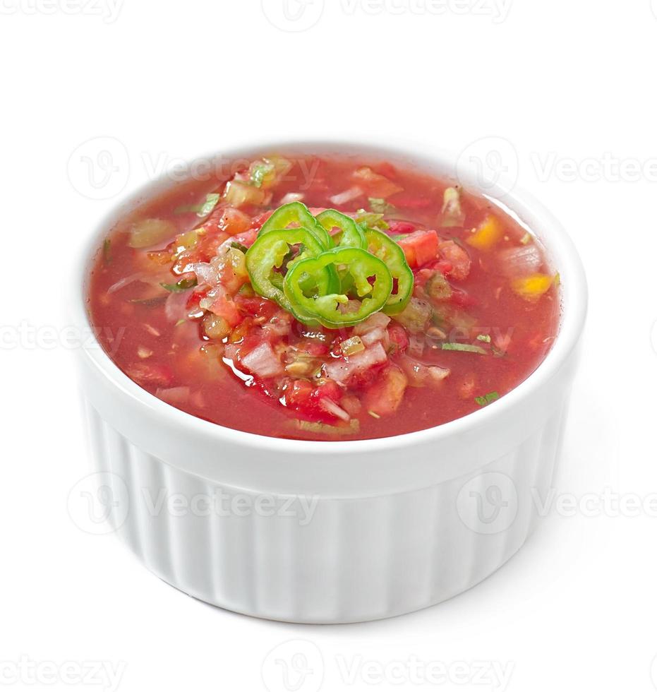 Bowl of fresh salsa dip isolated on white background photo