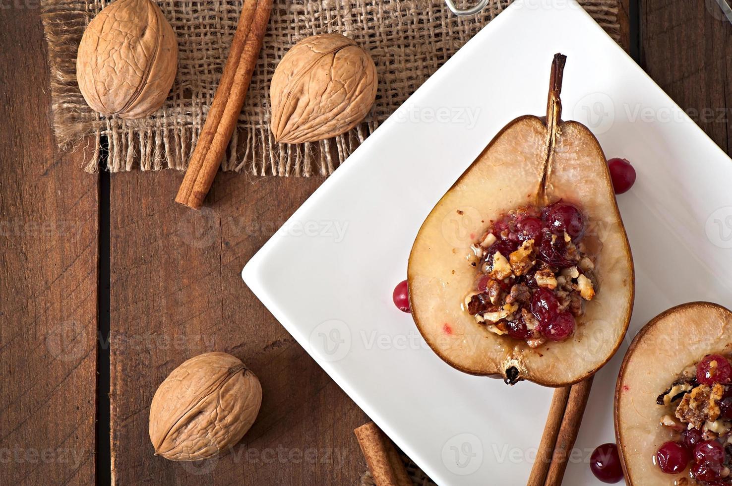 Baked pears with cranberries, honey and walnuts photo