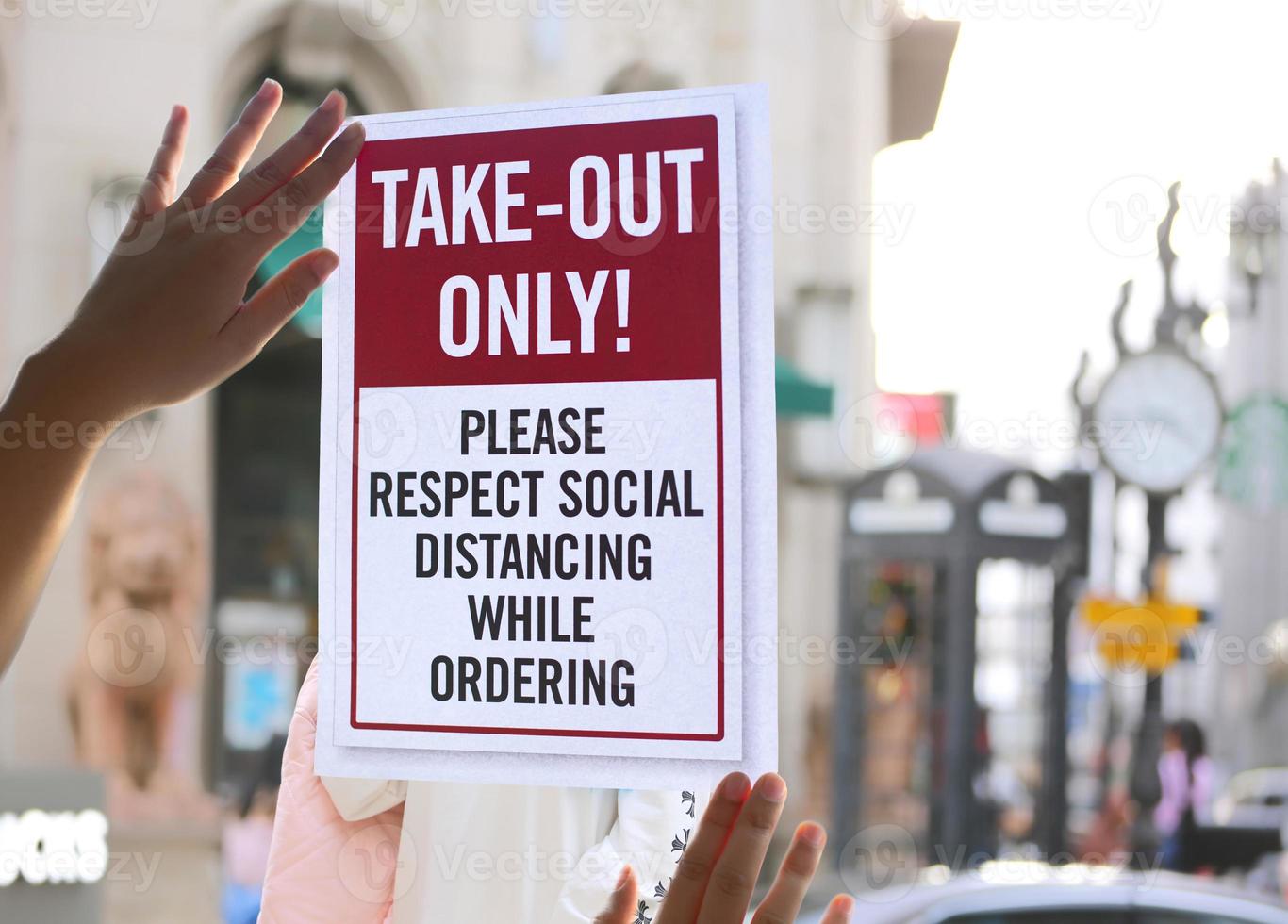 Delivery and take out only notice paper or takeout sign on window door during covid19 outbreak. photo