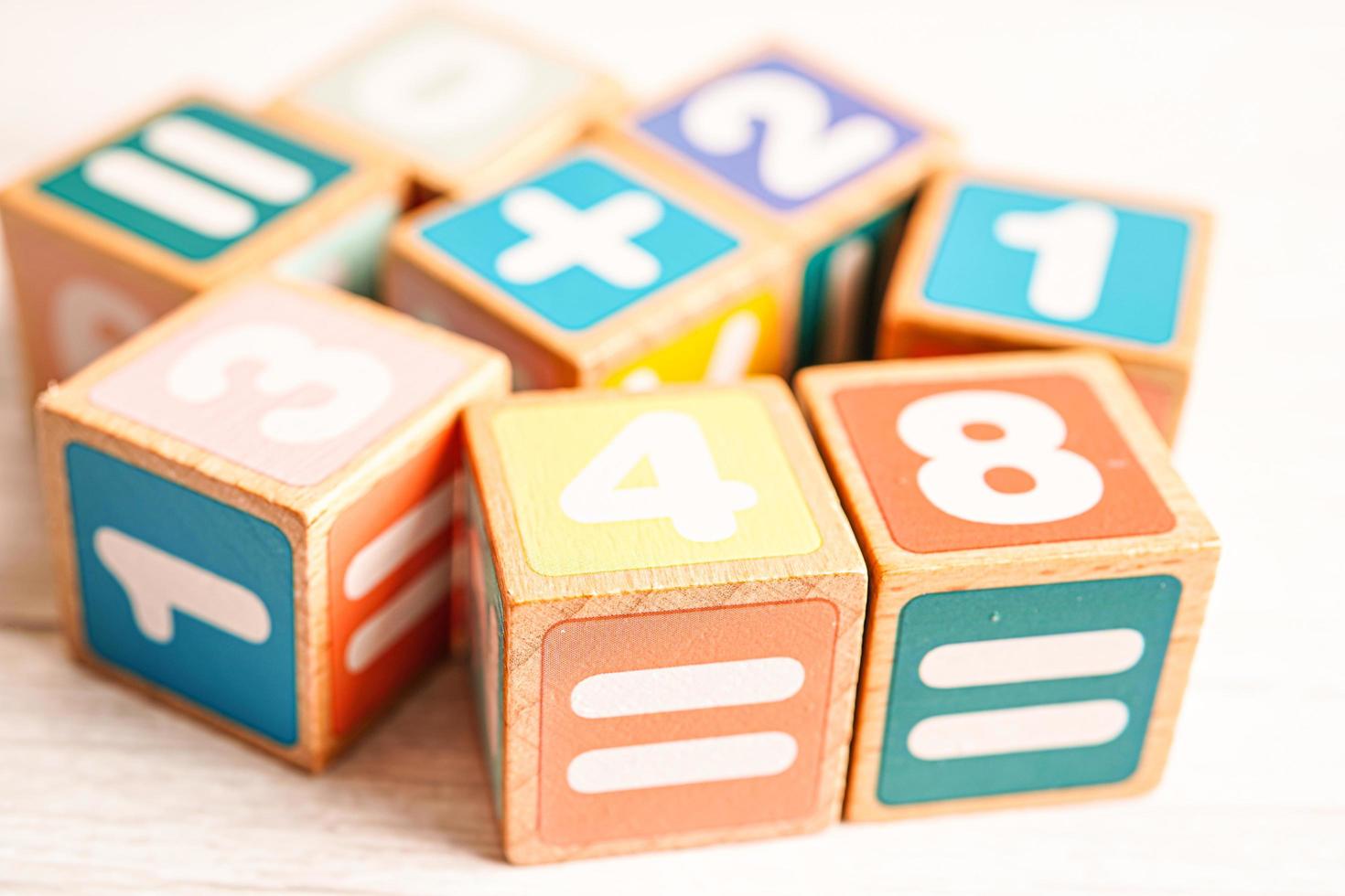 Number wood block cubes for learning Mathematic, education math concept. photo