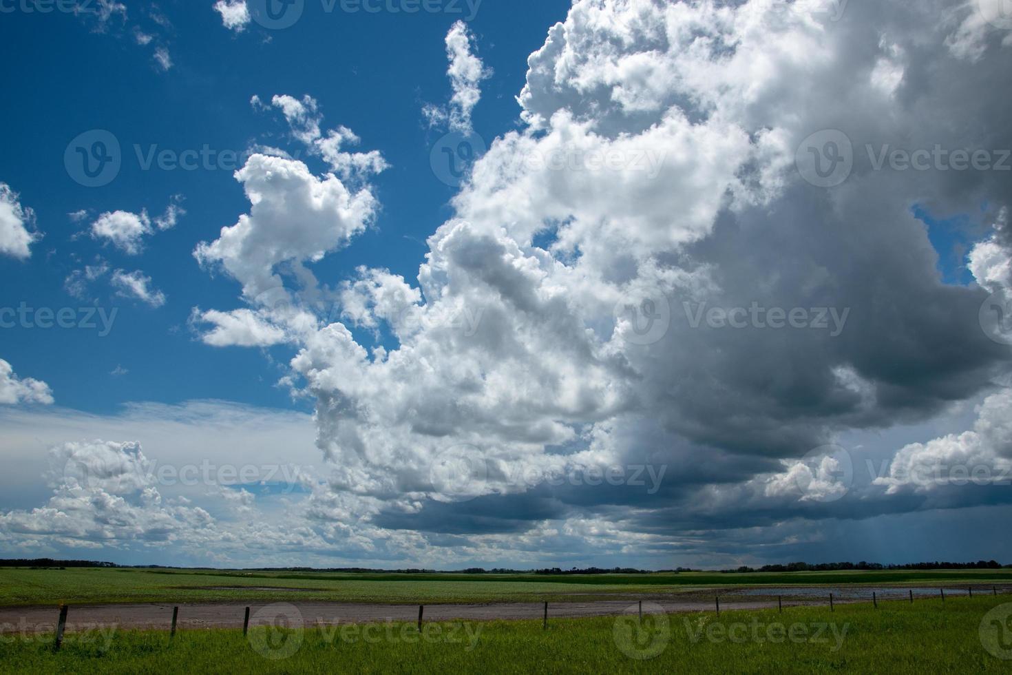 Rain clouds approaching above farmland, Saskatchewan, Canada. photo