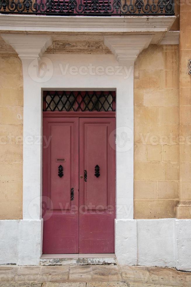 Bright colourful door way in a stone building photo