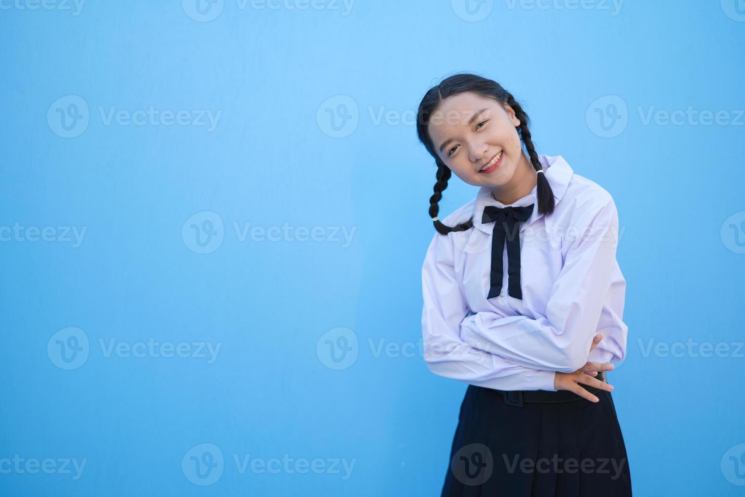 School girl on blue background. photo