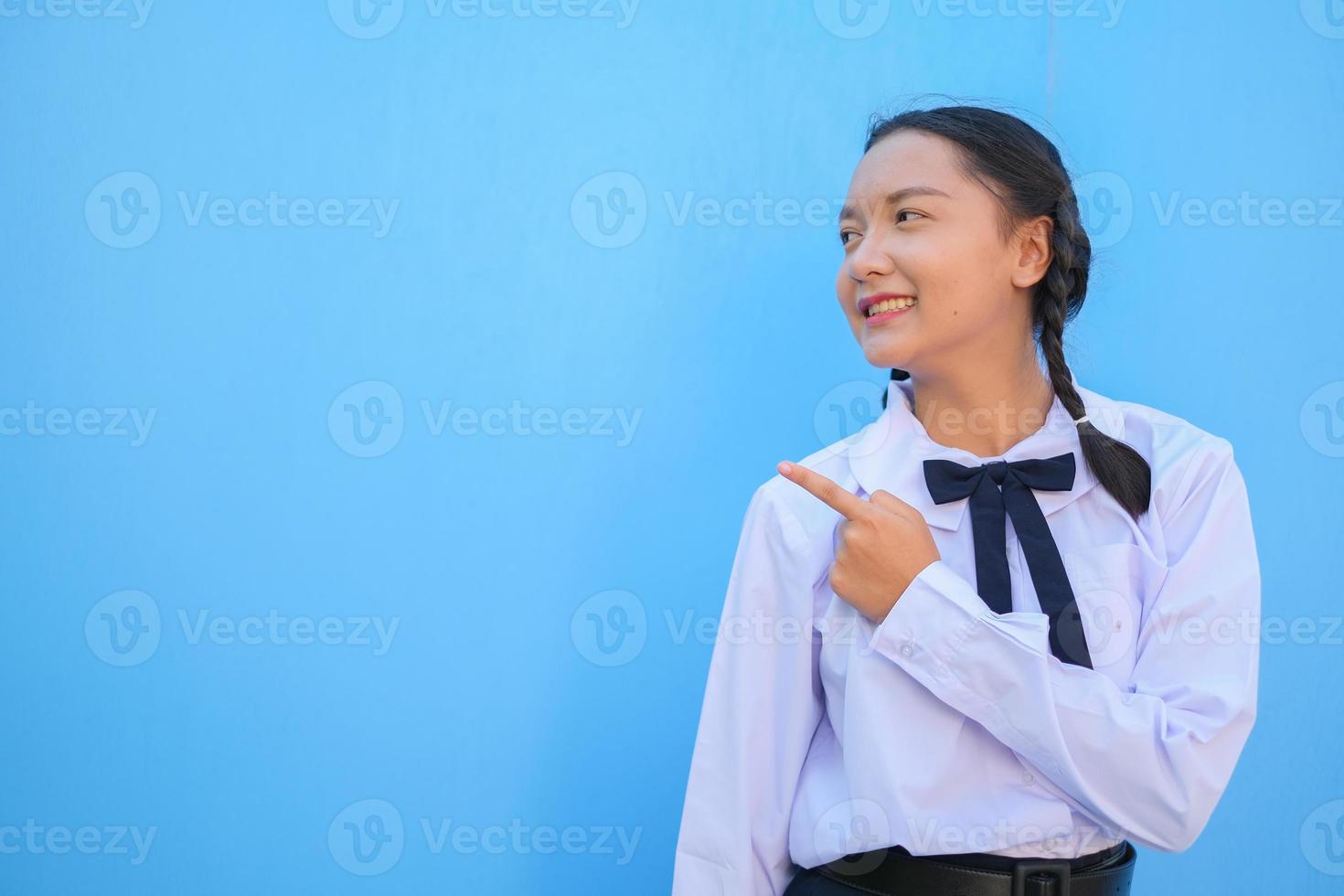 School girl on blue background. photo