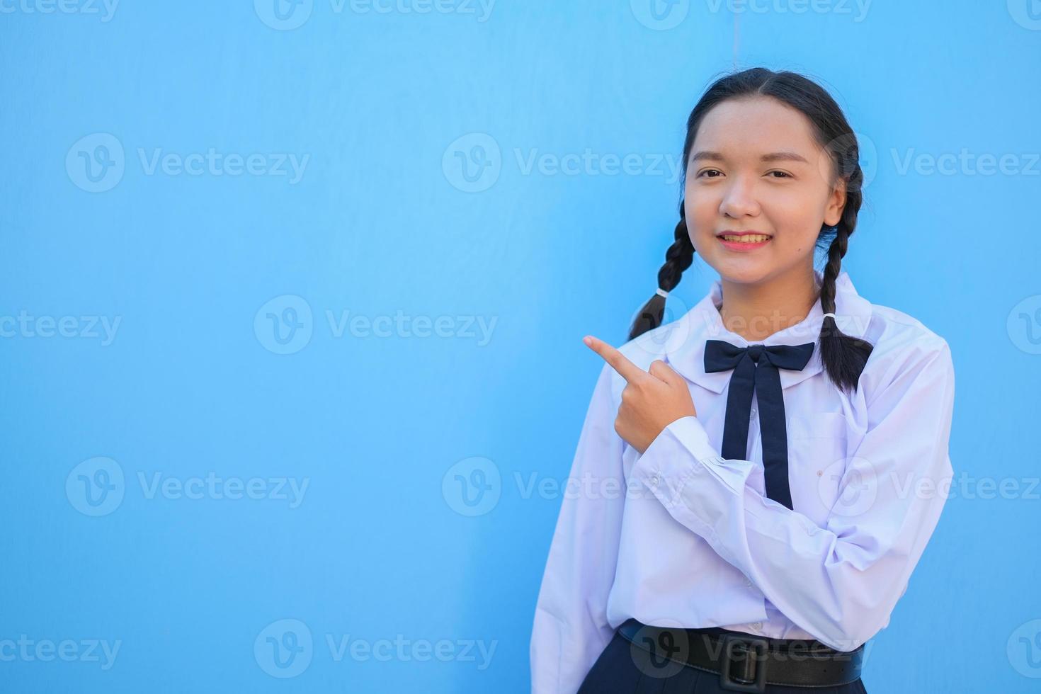 School girl on blue background. photo