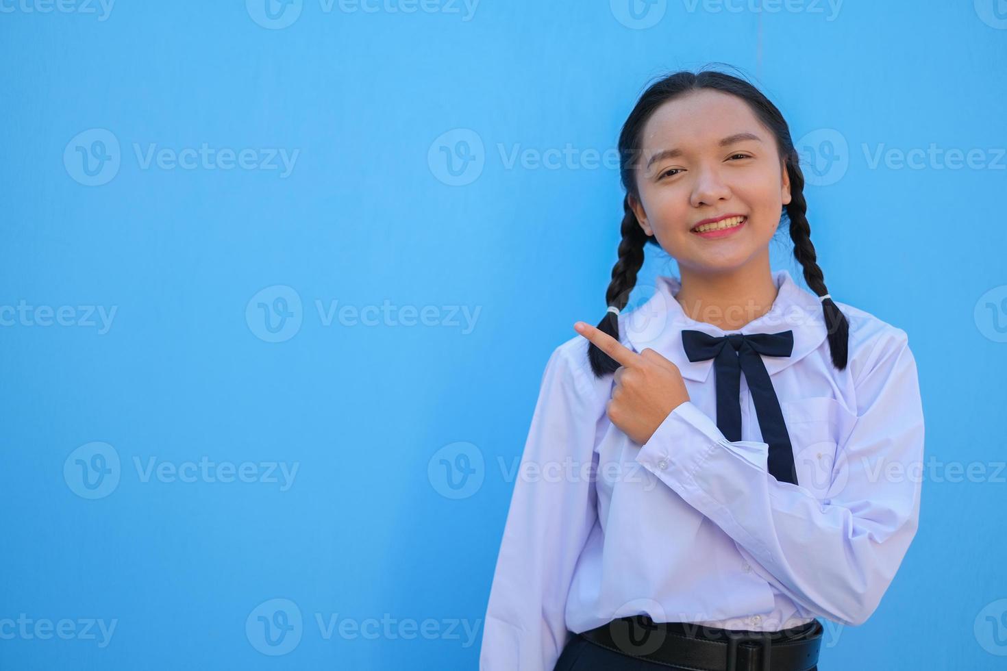 School girl on blue background. photo