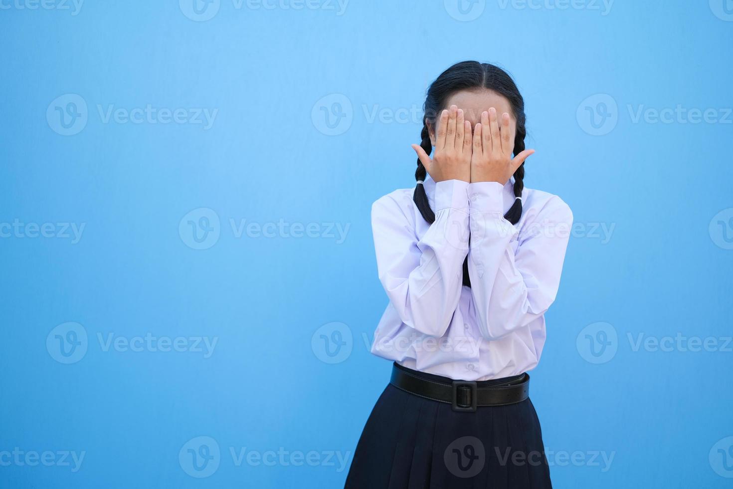 School girl on blue background. photo