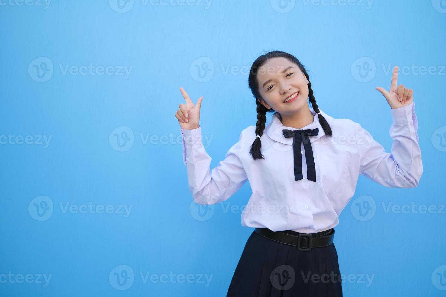 School girl on blue background. photo