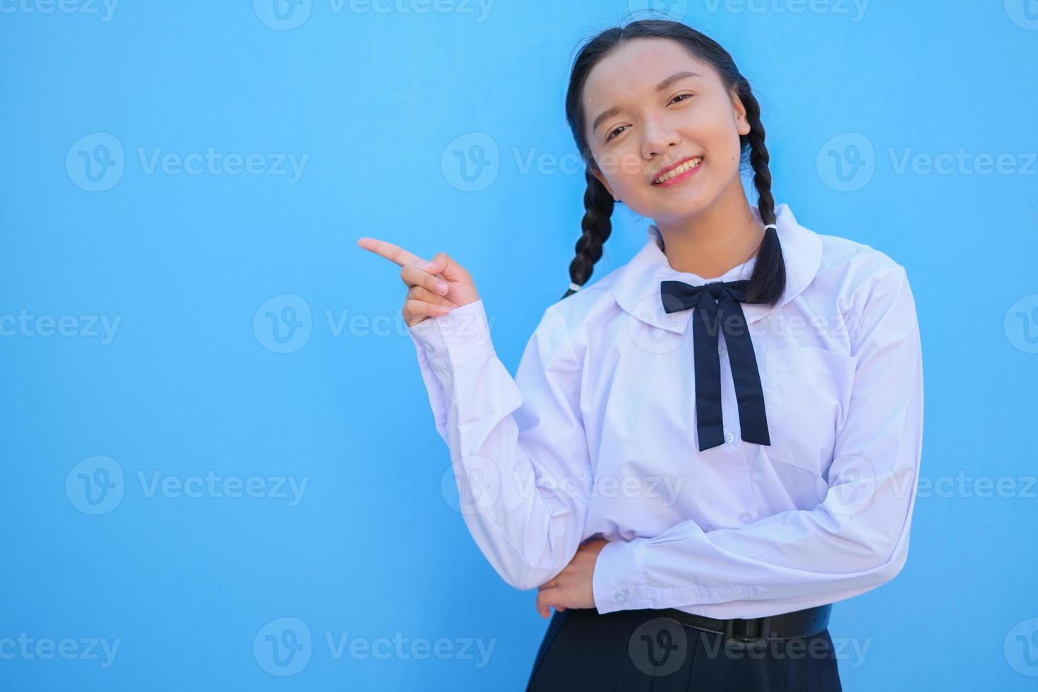 School girl on blue background. photo