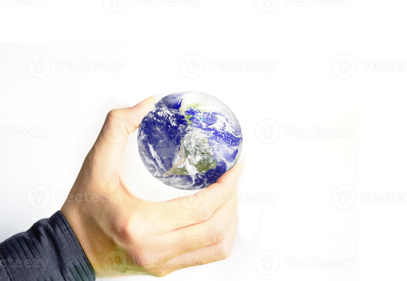 Hand holds clear lens camera filter on white background with light focus photo