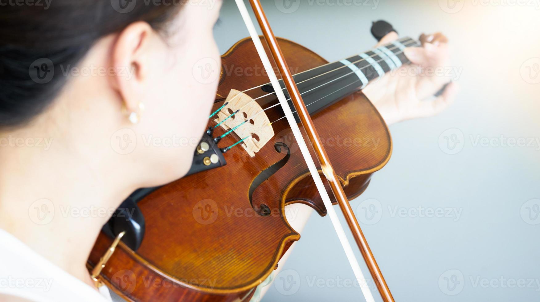 asian woman practice violin photo