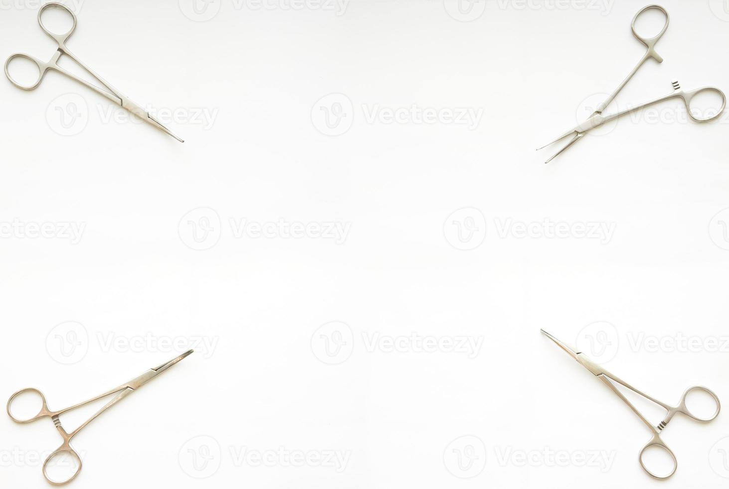 cramp forceps on corner of white copy space photo