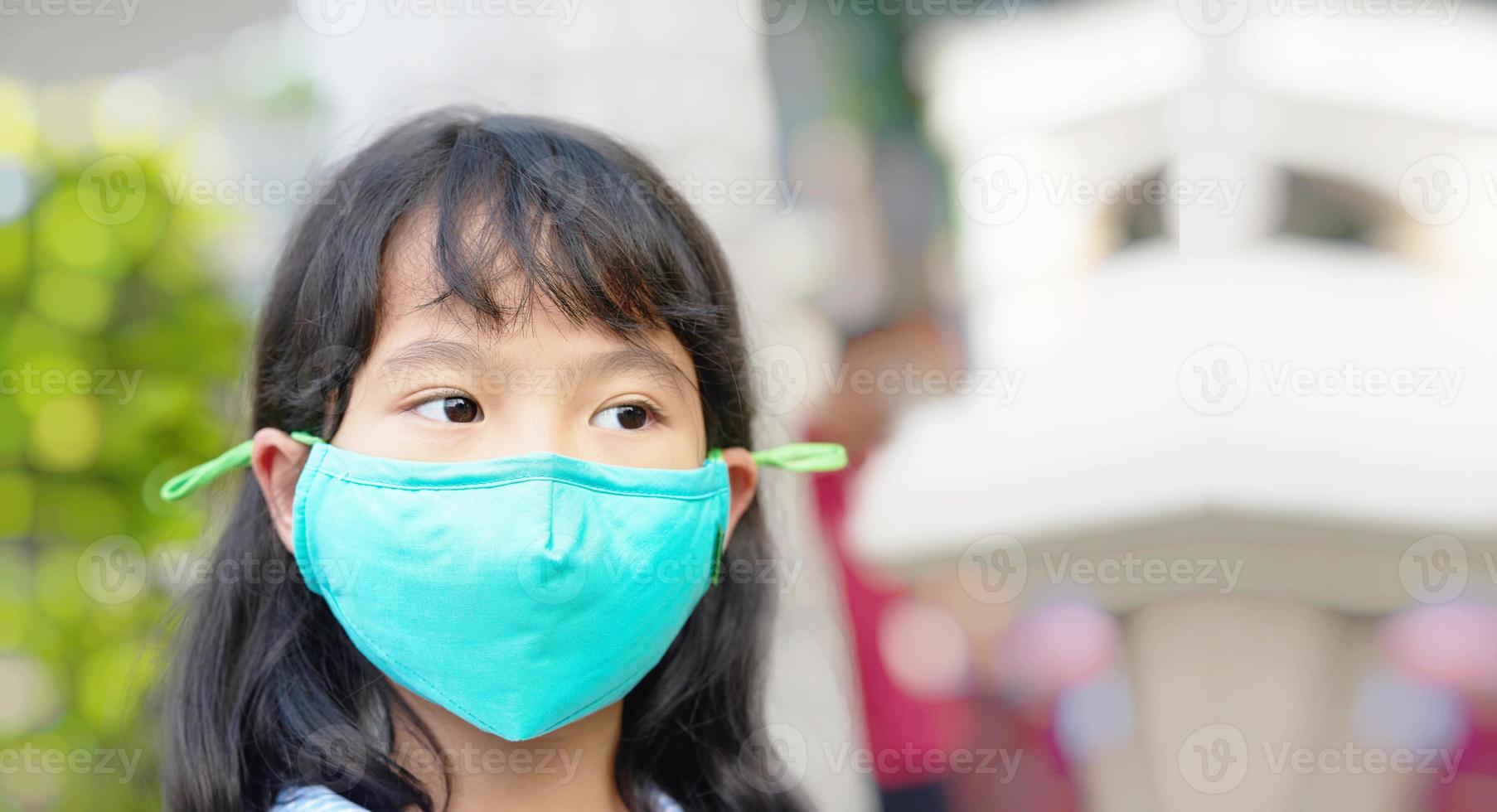kid waers mask for protection of pm dus photo