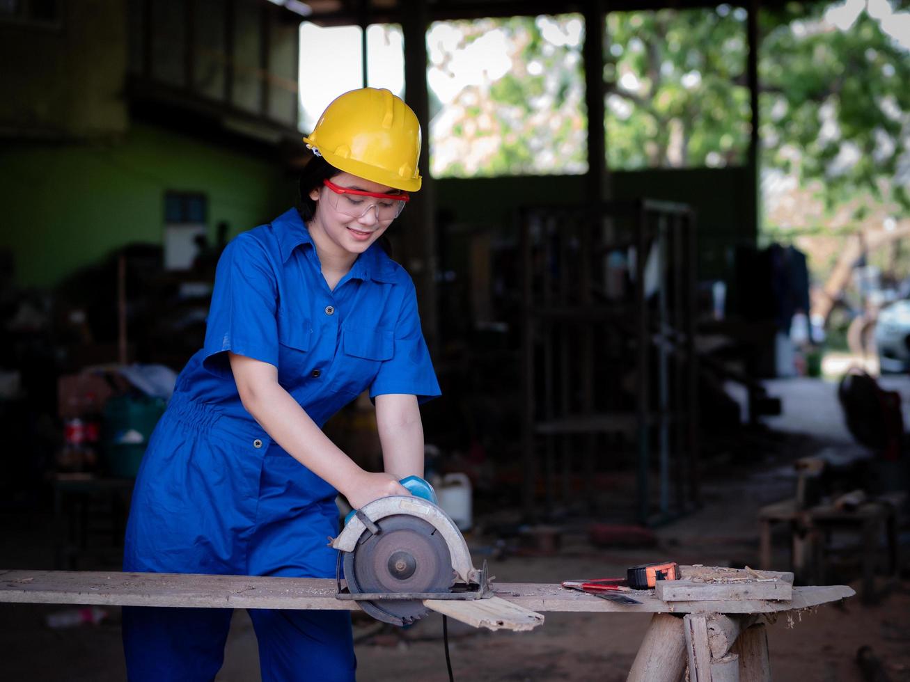 Women in uniform working, technicians are using power tools photo