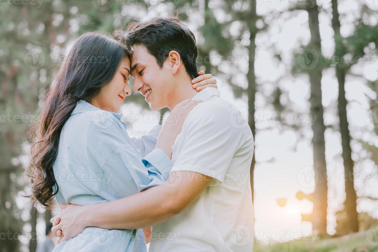 Portrait of young Asian couple outside photo