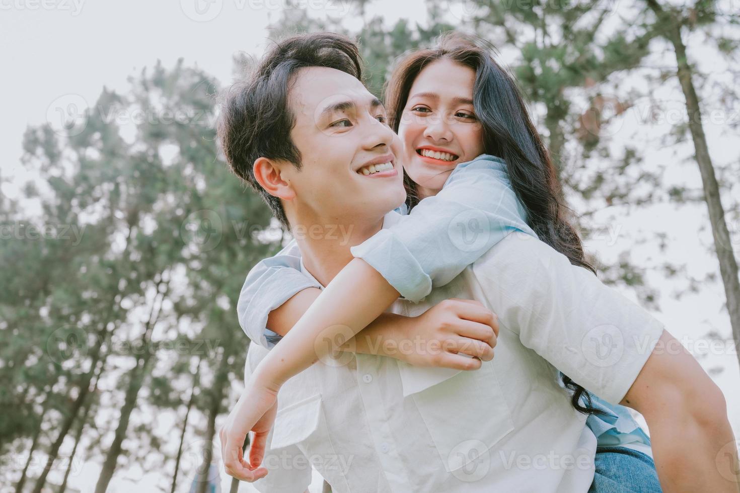 Portrait of young Asian couple outside photo