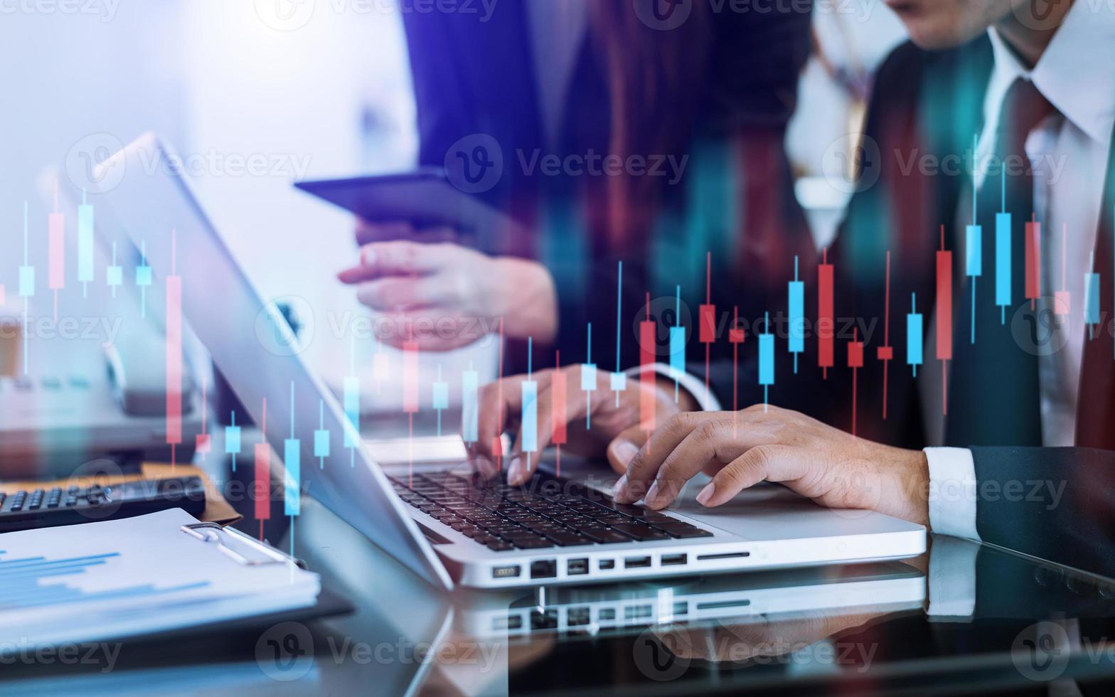 Two stock traiders making analysis of digital market and investment photo