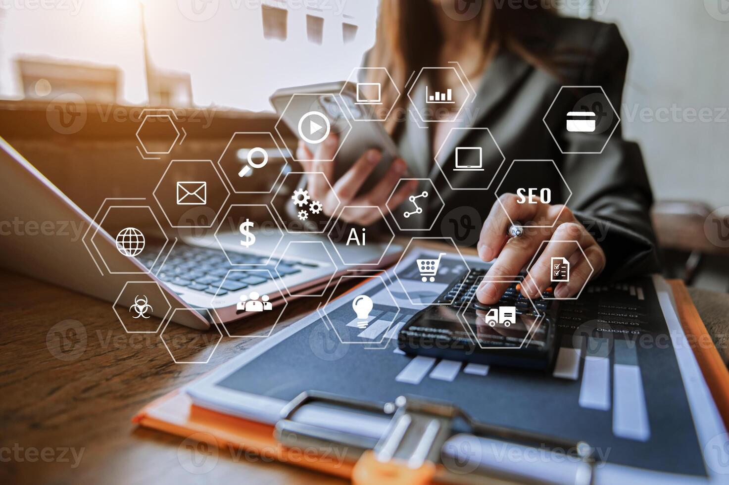 Businesswoman using mobile phone and laptop computer on white desk big data analytics with business intelligence concept. with VR chart  with icon photo