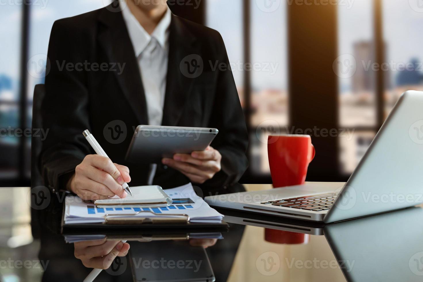 businessman hand working with new modern computer and writing on the notepad strategy diagram as concept photo