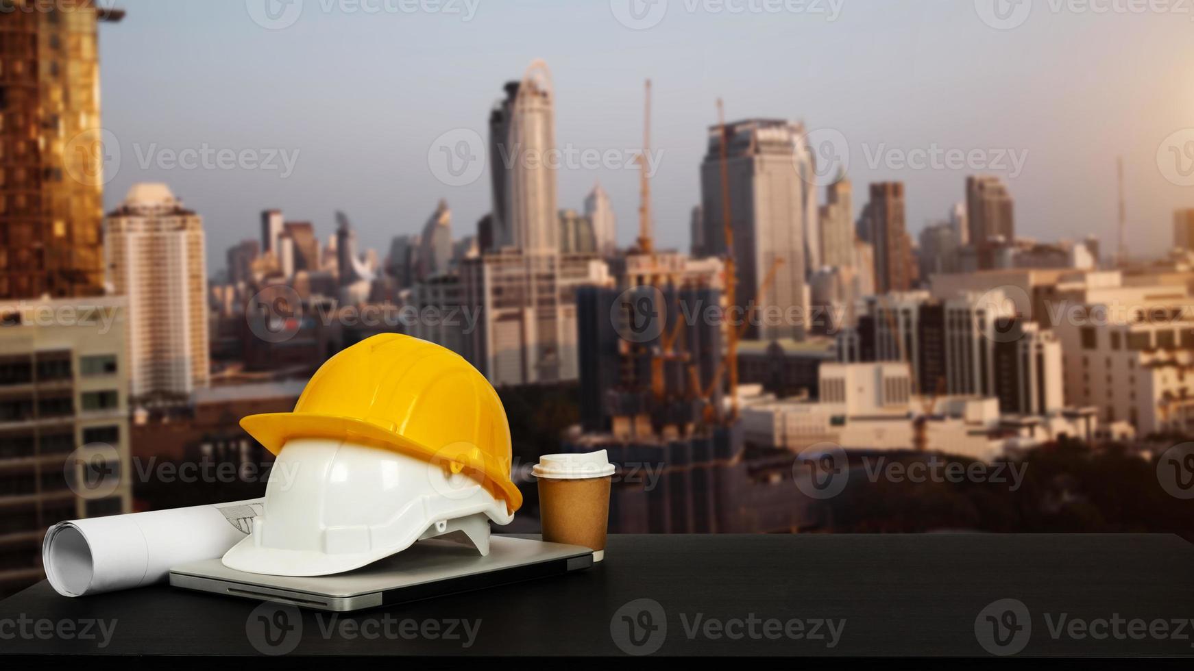 Construction house and building. Repair work. Dof laptop computer and office construction on table in office blurred background. photo