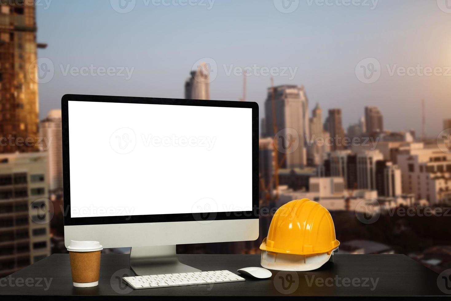 Workspace computer putting  and office construction on table in office blurred background.Architect concept. photo