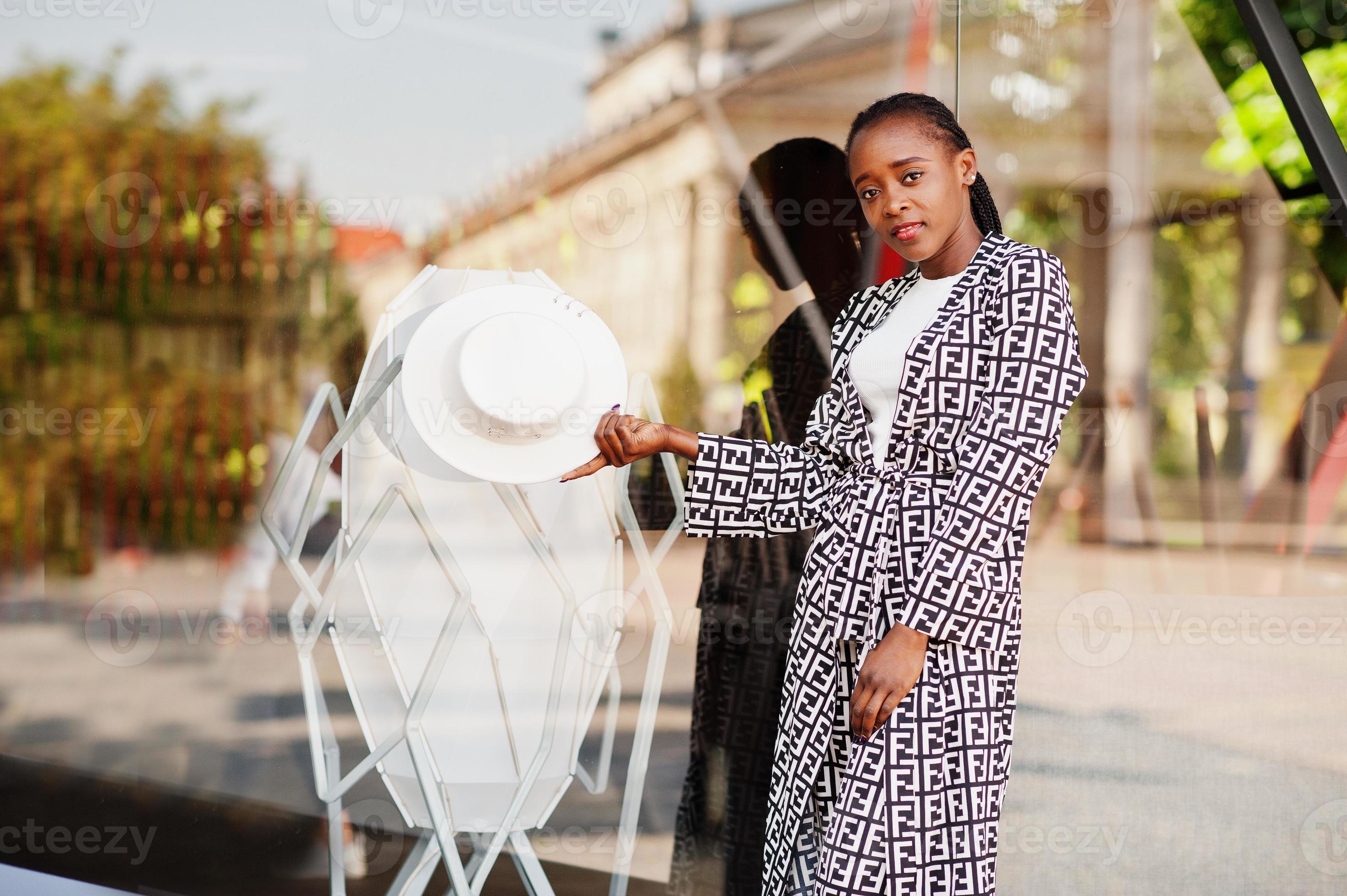 Beautiful african american woman natural makeup wear fashion clothes casual  black and white dress code office style total blouse and pants suit and  hat. 7219164 Stock Photo at Vecteezy