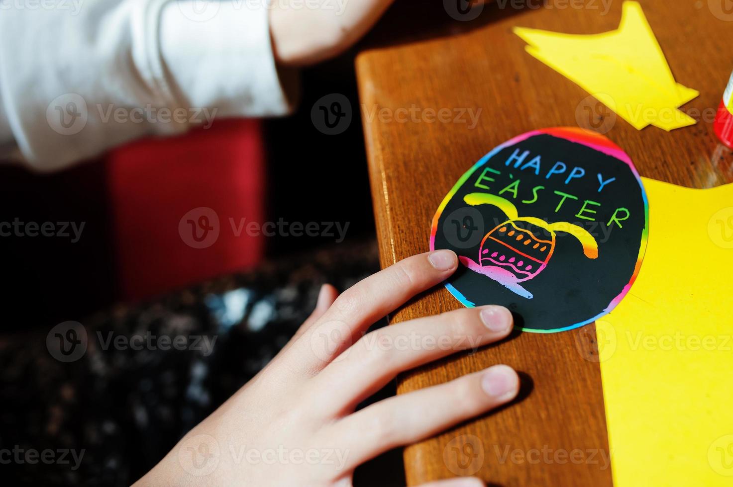 Preparing to Easter concept. Happy Easter on egg, baby hand. photo