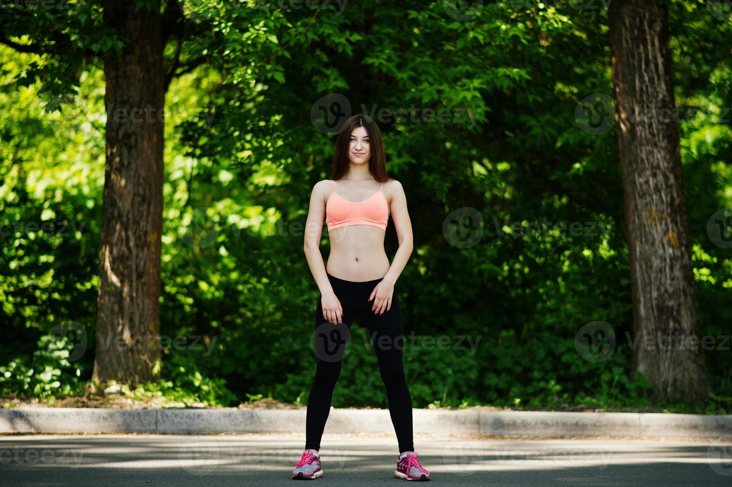 Fitness slim sexy sport girl in sportswear posed in road at park, outdoor  sports, urban style. 7219070 Stock Photo at Vecteezy