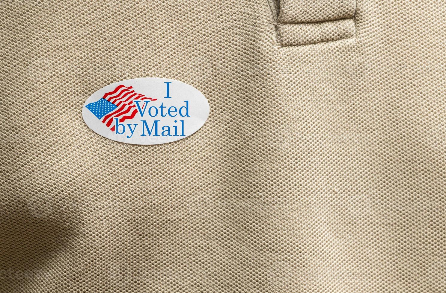 I Voted by Mail paper sticker on shirt to illustrate voting by mail in election photo
