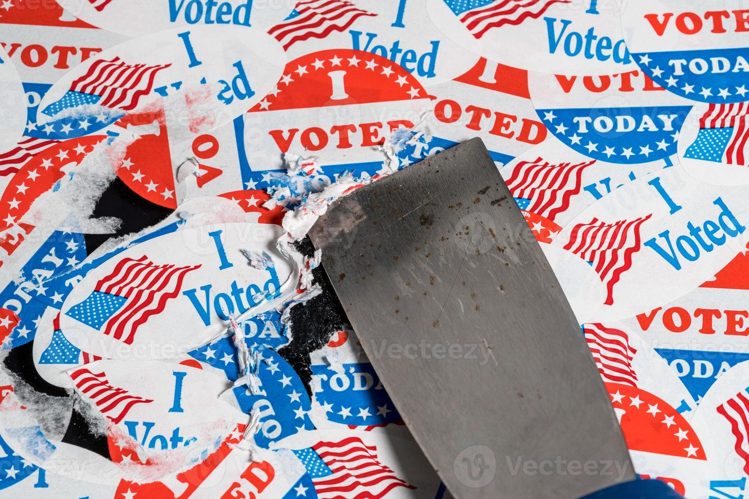 Set of election campaign badges stuck on glass and being removed after election is over photo