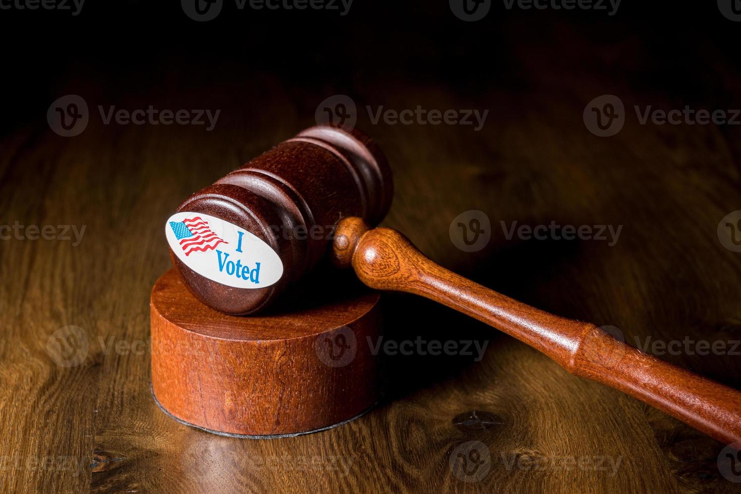 I voted campaign button or sticker with a gavel and mallet to illustrate lawsuits about voting photo